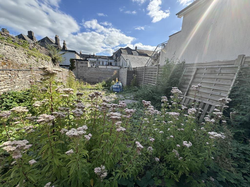 Lot: 41 - LAND WITH POTENTIAL - View beyond the metal gate